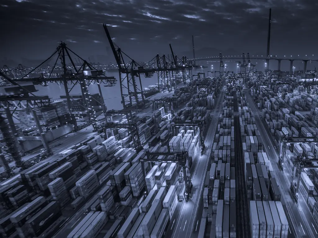 Container port with cranes and stacked shipping containers